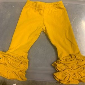 Persnickety 12 month gold ruffle pants. Smoke free home.